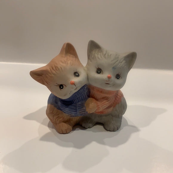 Two kittens holding hands figurine